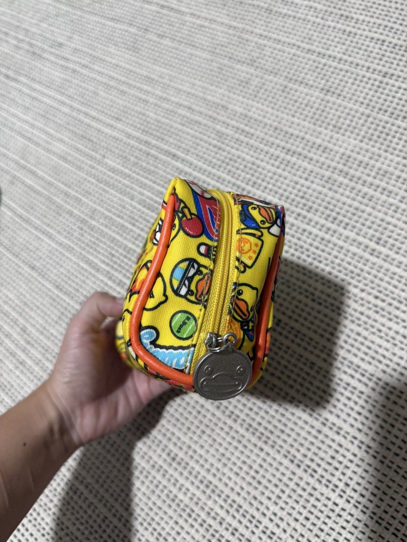 B duck yellow pouches (Category: Purses & Pouches) located in Manila. Submitted by morningthrifters (Listing ID 1463888873, Image 3). Description: Bduck pouches Good as new Kasya ang charger, pwede lagayan ng makeup, pwede din digicam or abubots.