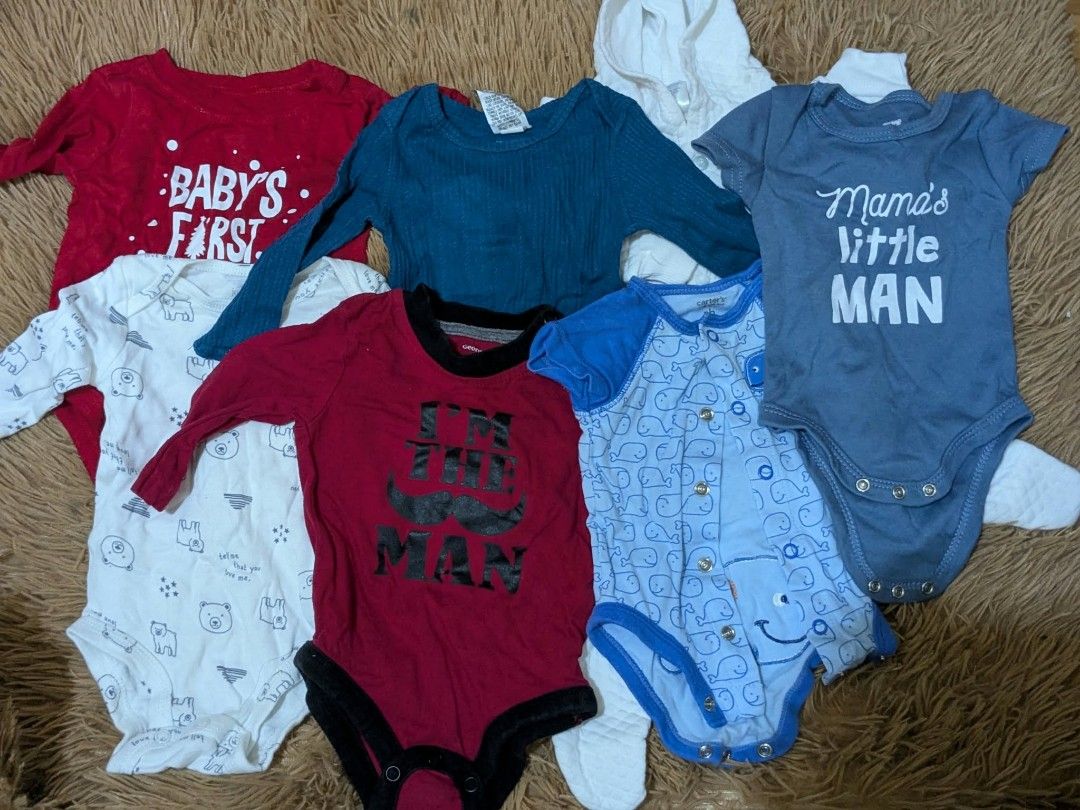 Baby Boy Bodysuits Bundle - Various Brands & Sizes (Category: Babies & Kids Fashion) located in Manila. Submitted by russelsimo37305 (Listing ID 1463895972, Image 1). Description: - Bundle of 6 baby boy bodysuits - Includes both long and short sleeve options - Features cute designs: 'Baby's First', 'Mama's Little Man', 'I'm The Man' (with mustache), whale print, and bear print - Brands include popular names like Carter's and George - Ideal for ev