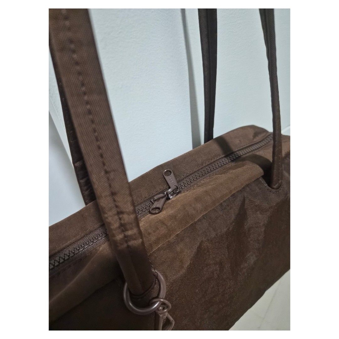 Baggu Nylon Bowler Bag (Category: Shoulder Bags) located in Bacoor. Submitted by _sysells (Listing ID 1463855382, Image 2). Description: Baggu Nylon Bowler Bag in Coffee. Purchased from Certified Calm in July 2026. No stain/flaw. Last price posted. Dimensions: 11 3/4" W x 6" H x 4" D RFS: Purchased the wrong size online/doesn't fit my laptop..