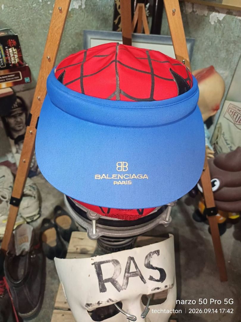 Balenciaga Golf Club Visor Cap (Category: Caps & Hats) located in Santo Tomas. Submitted by pickers_corner (Listing ID 1463932614, Image 1). Description: vintage 1990 BALENCIAGA BB Logo Visor Hats Free size very good condition - Authentic Balenciaga Golf Club visor - Stylish blue brim with Balenciaga Paris logo - Crafted in Japan - Ideal for sun protection and a fashionable look.