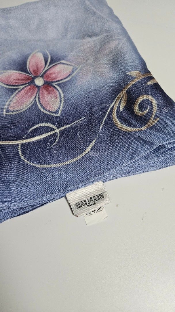Balmain silk scarf (Category: Women's Watches) located in Alfonso. Submitted by jbcamet (Listing ID 1463823841, Image 1). Description: - Brand: Balmain - Material: Silk - Design: Blue and pink floral pattern with swirling accents - Adds elegance to any outfit.