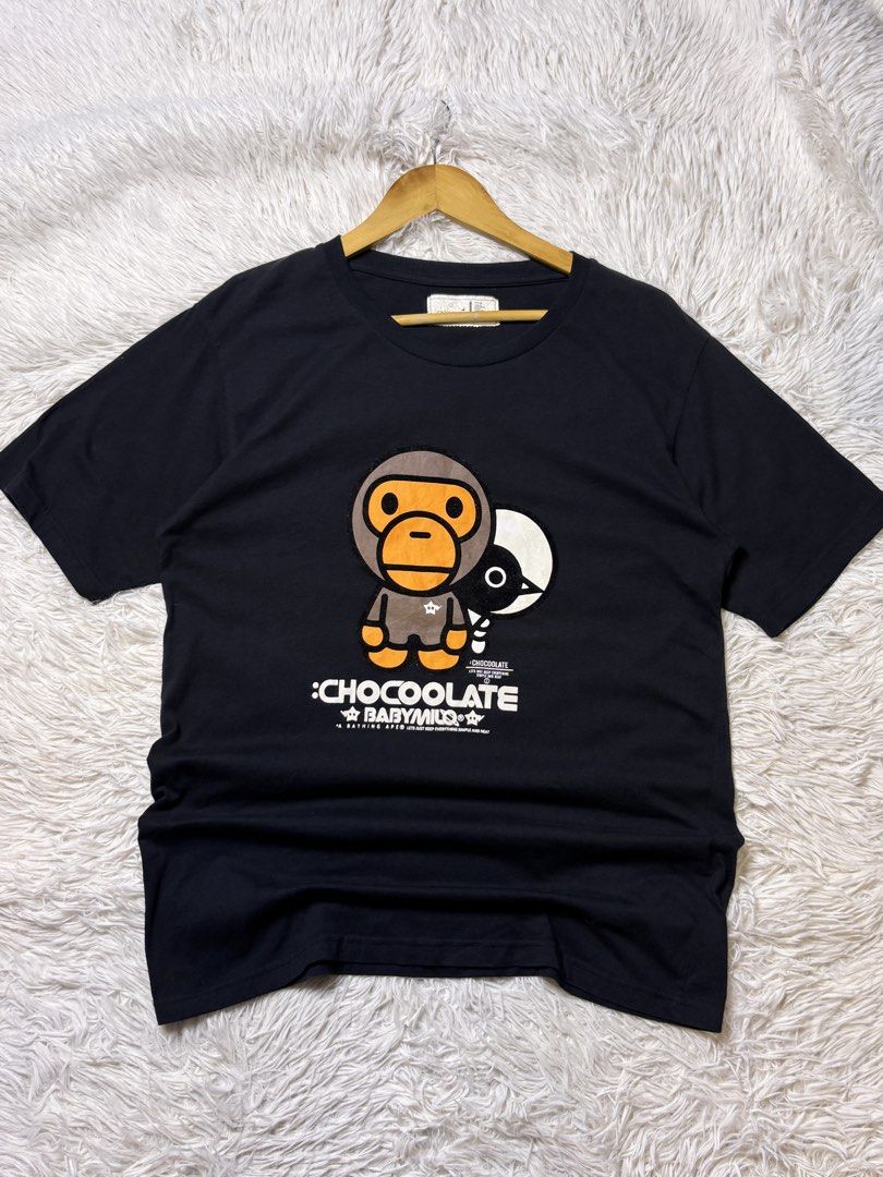 BAPE BABYMILO x CHOCOLATE TEE (Category: Shirts) located in Catbalogan. Submitted by christopszxc31 (Listing ID 1463841785, Image 1). Description: - BAPE BABYMILO x CHOCOLATE Black T-Shirt - Tagged Size: L - Features iconic BABYMILO character and bird graphic print - Ideal for streetwear enthusiasts and A Bathing Ape fans.