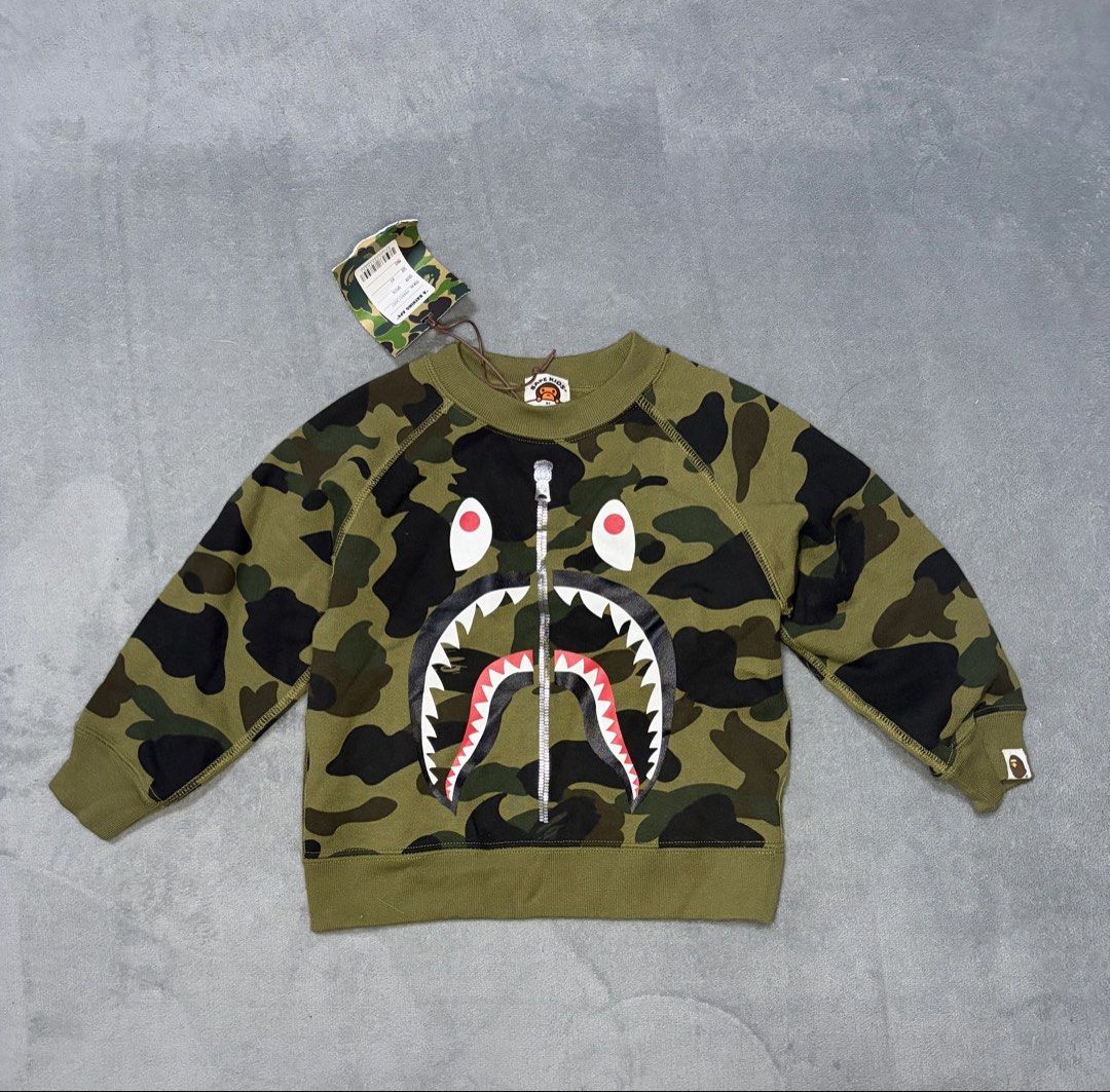 BAPE Kids Camo Shark sweatshirt (Category: Hoodies) located in Koronadal. Submitted by archivesdept (Listing ID 1463857085, Image 1). Description: BAPE Kids Camo shark sweatshirt size 90 never been used PHP 4,000 DM me.
