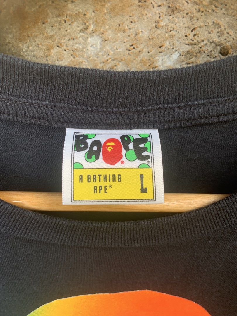 BAPE Rainbow Ape Head T-Shirt (Category: Tshirts & Polo Shirts ) located in Aloran. Submitted by chester78864 (Listing ID 1463904172, Image 3). Description: - Authentic BAPE T-shirt - Features the iconic rainbow ape head graphic - "BY BATHING APE" text detail - Size: Large (L) - Comes with original tags.