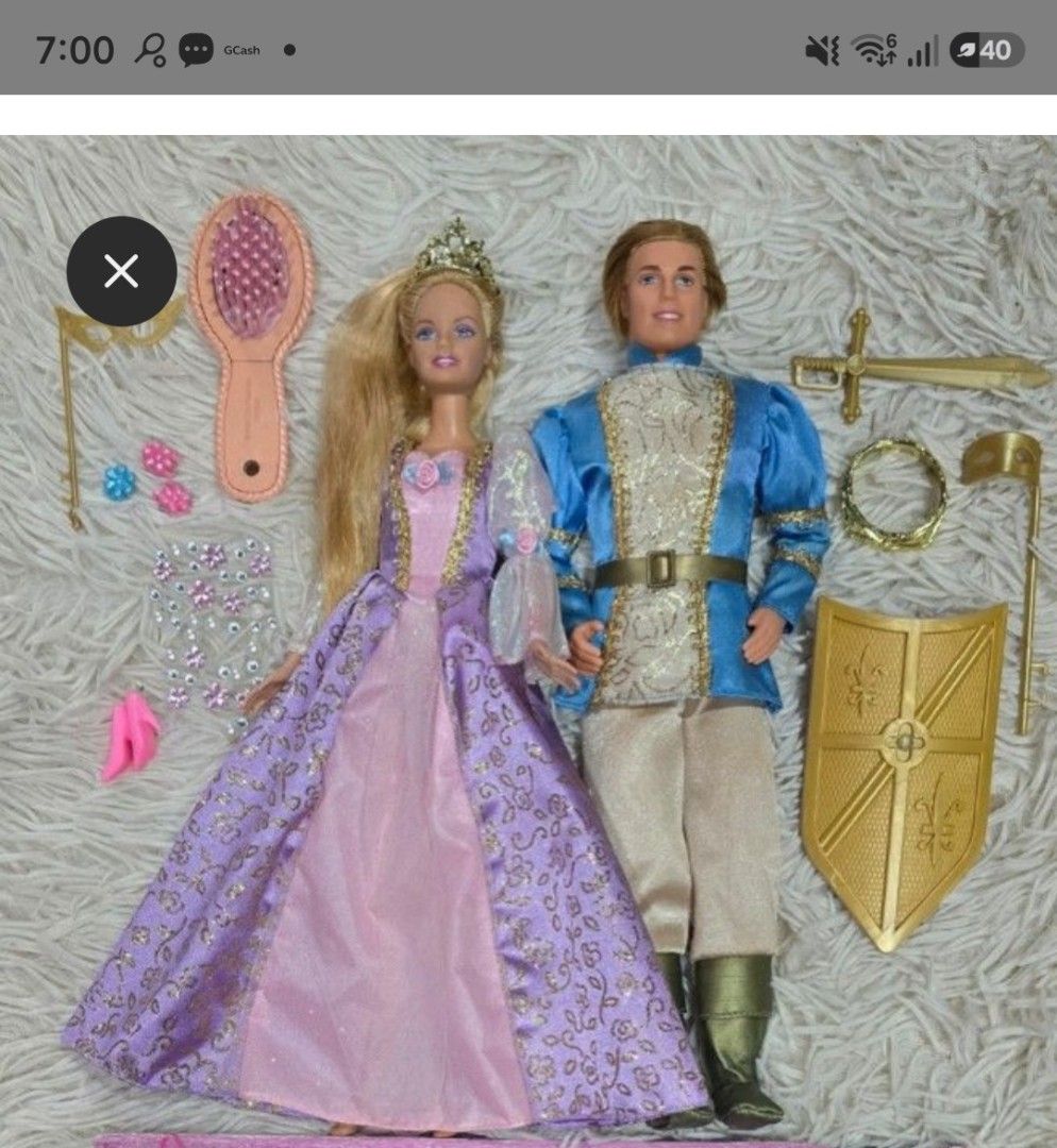 Barbie and Ken Rapunzel set. (Category: Kids Toys) located in Meycauayan. Submitted by martinezmanika (Listing ID 1454240809, Image 2). Description: Barbie with working gimmick. Indonesia Version. Very pretty. Musical Brush is working Ken gimmick still working but needs battery replacement. Comes with everything you see in the picture. Bonus stickon jewels for Rapunzel hair. extra outfit. NO BOX..