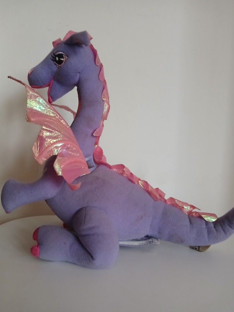 Barbie as Rapunzel 2002 Penelope Dragon (Category: Plushies & Soft Toys) located in Subic. Submitted by frncnjntmr22 (Listing ID 1463823018, Image 3). Description: - Adorable purple dragon plush toy - Features sparkly pink wings - Rainbow gradient on its belly - Super soft and huggable material - Ideal for playtime or as a cute decoration - A must-have for any dragon lover! "working" "ignore & pass sa barat at maaarte perpeksyunista lumayas.".