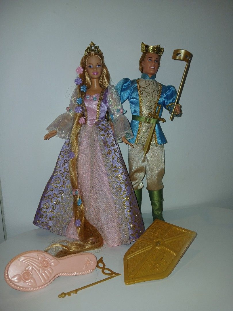 Barbie as Rapunzel & Prince Stefan set 2002 (Category: Kids Toys) located in Subic. Submitted by frncnjntmr22 (Listing ID 1463841013, Image 1). Description: - Princess doll with long blonde hair and flower accents - Prince doll in a blue and gold outfit - Accessories included: crown, sword, shield, and hairbrush - Encourages imaginative play - Perfect gift for Barbie enthusiasts *ken not working anymore retested already. "ignore& pass sa barat at