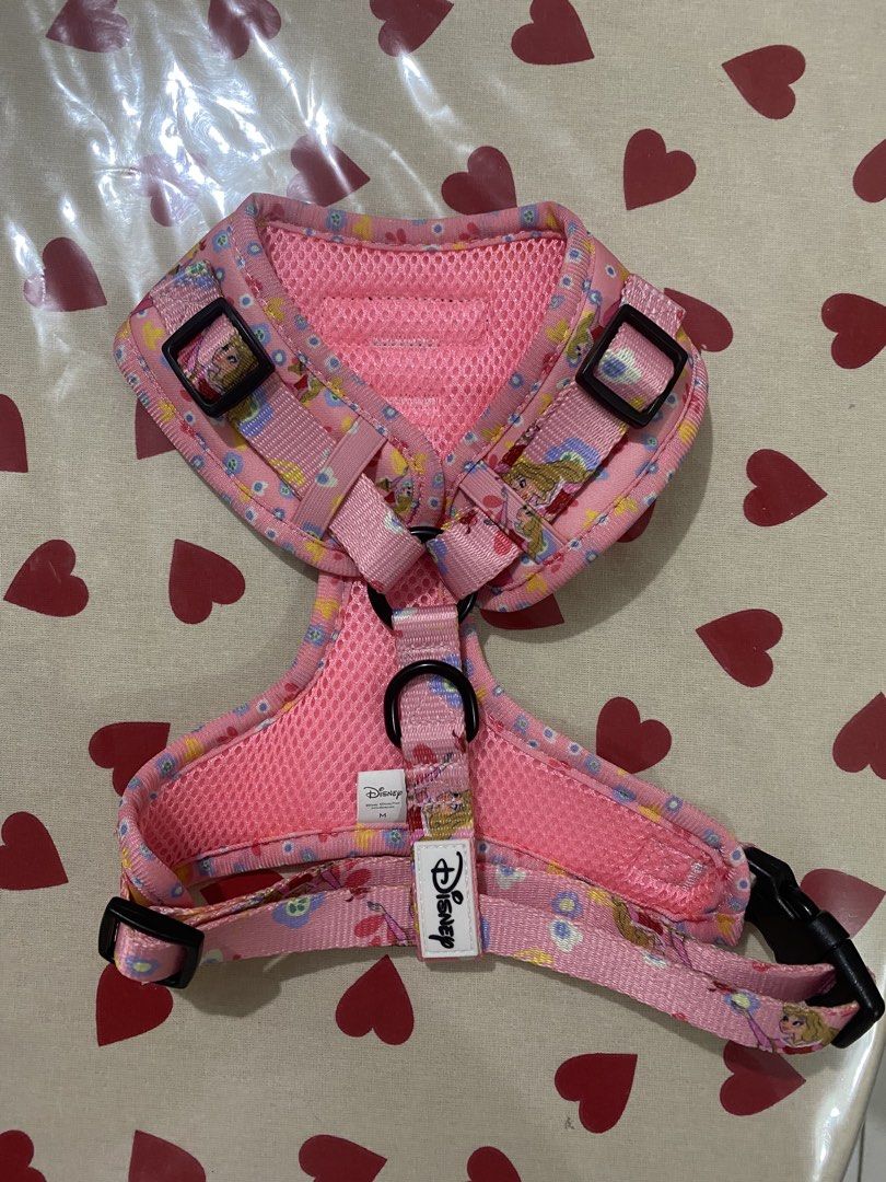 Bark & Spark Disney Princess Dog Harness (Category: Homes & Other Pet Accessories) located in Las Pinas. Submitted by AnyaLovesThrifting (Listing ID 1463867210, Image 2). Description: - Adorable pink dog harness with a charming Disney Princess print. - Features a comfortable mesh lining for your pet's comfort. - Adjustable straps for a secure and customized fit. - Includes a D-ring for easy leash attachment. - Ideal for daily walks, adventures, a