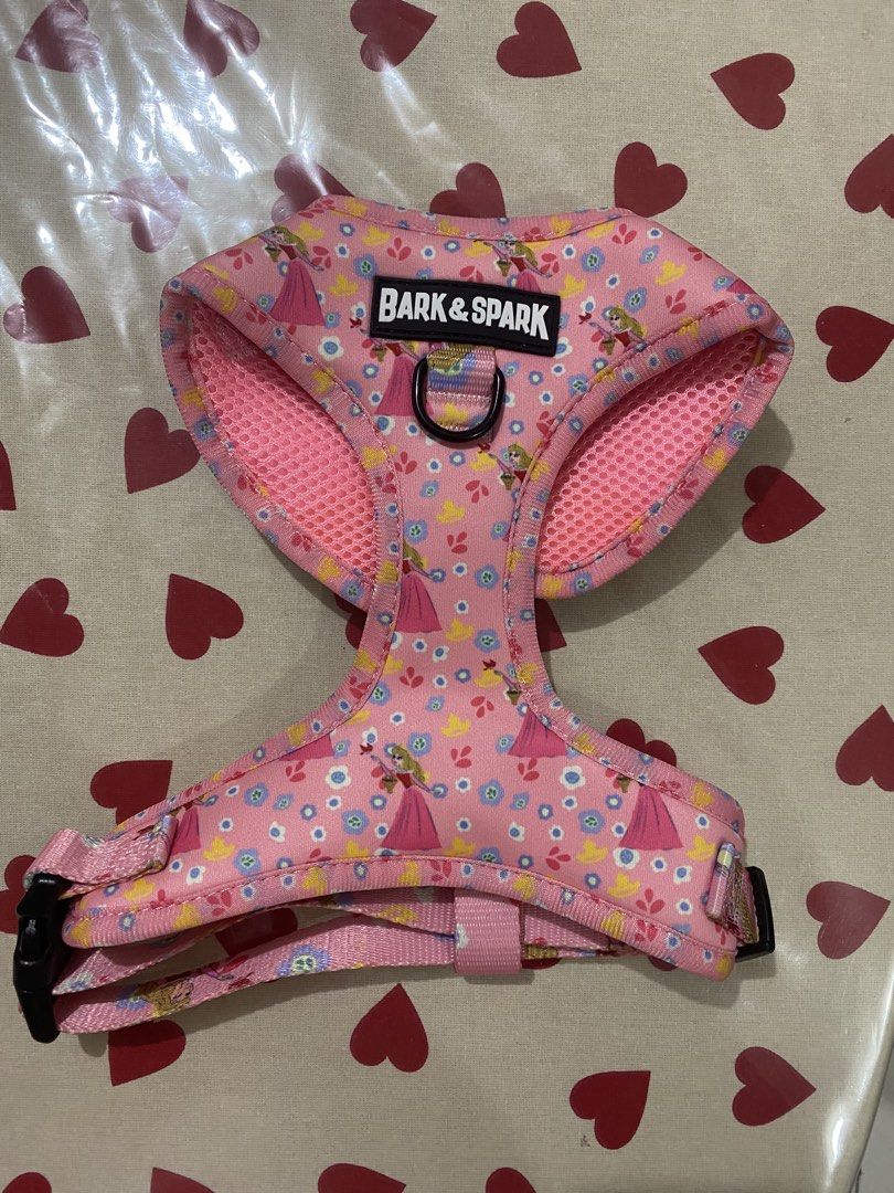 Bark & Spark Disney Princess Dog Harness (Category: Homes & Other Pet Accessories) located in Las Pinas. Submitted by AnyaLovesThrifting (Listing ID 1463867210, Image 1). Description: - Adorable pink dog harness with a charming Disney Princess print. - Features a comfortable mesh lining for your pet's comfort. - Adjustable straps for a secure and customized fit. - Includes a D-ring for easy leash attachment. - Ideal for daily walks, adventures, a