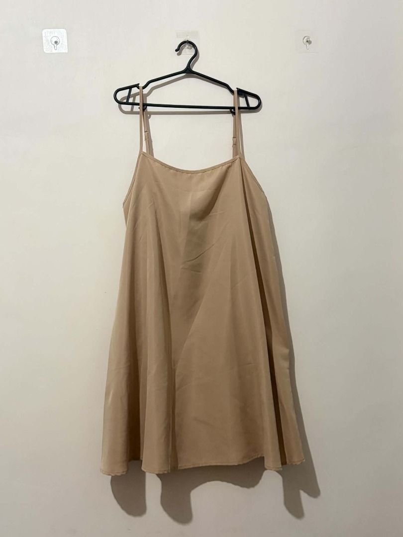 Beige Spaghetti Strap A-Line Mini Dress (Category: Dresses) located in San Leonardo. Submitted by burgossanleonardo.12345 (Listing ID 1463910036, Image 2). Description: - Simple and chic beige mini dress - Features delicate spaghetti straps - Flattering square neckline - Classic A-line silhouette - Elegant scalloped hem detail - Lightweight fabric, perfect for layering or wearing on its own - Versatile piece for any occasion.