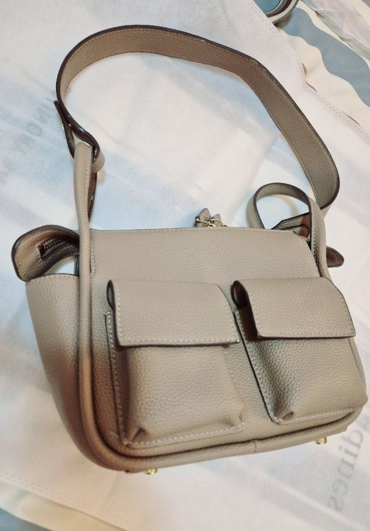 Beige Textured Leather Handbag with Multiple Pockets and Straps (Category: Luxury Bags & Wallets) located in Manila. Submitted by jonnahserran (Listing ID 1463852425, Image 2). Description: used - good with 2 extra straps.