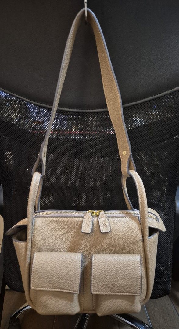 Beige Textured Leather Handbag with Multiple Pockets and Straps (Category: Luxury Bags & Wallets) located in Manila. Submitted by jonnahserran (Listing ID 1463852425, Image 1). Description: used - good with 2 extra straps.