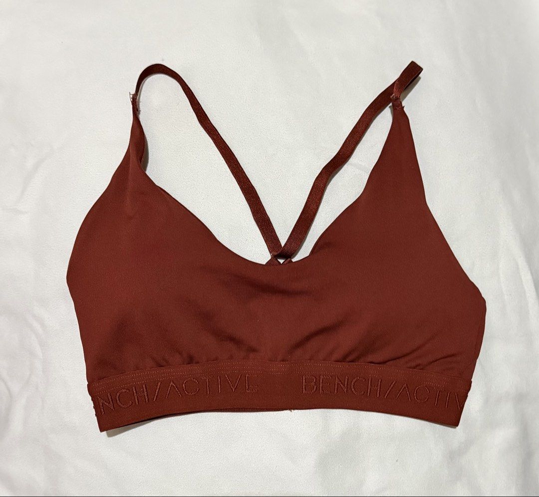 Bench Active Sports Bra (Category: Activewear) located in Paranaque City. Submitted by declutternsell.729 (Listing ID 1463774243, Image 1). Description: - Bench Active sports bra in a chic rust color. - Stylish criss-cross strap design at the back. - Comfortable elasticated band with Bench/Active logo. - Material: 92% polyester, 8% elastane for a good stretch. - Care instructions: Hand wash in lukewarm water only. Do not bleach, tumble dry, or ir
