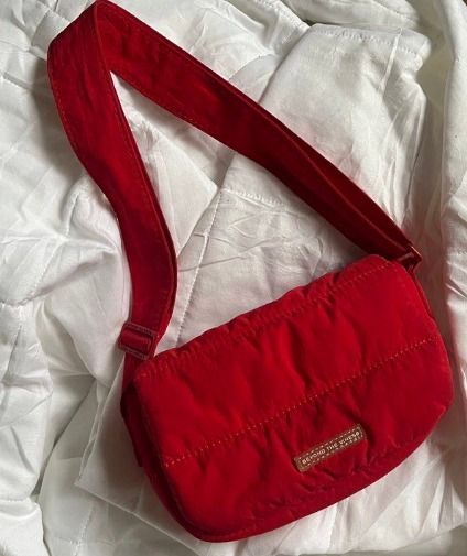 Beyond The Vines Red Puffer Sling Bag (Category: Cross-body Bags) located in Quezon City. Submitted by astargeaaa (Listing ID 1463759194, Image 1). Description: - Brand: Beyond The Vines - Color: Red - Style: Puffer Sling Bag - Material: Soft, lightweight - Features: Adjustable strap, easy to clean - Perfect for: Everyday use, carrying essentials (phone, wallet, keys) - Adds: A pop of color to any outfit.