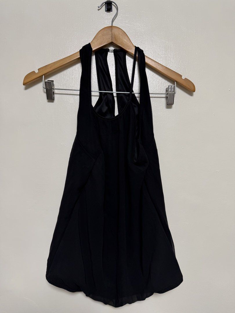 Black Halter Neck Tank Top (Category: Sleeveless) located in Manila. Submitted by don_p (Listing ID 1463868663, Image 2). Description: S to M - Black halter neck tank top - Unique strap design in the back - Flowy hemline - Versatile: great for layering or wearing on its own - Comfortable and stylish.