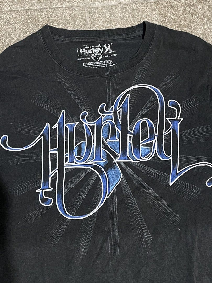 Black Hurley Graphic T-Shirt (Category: Tshirts & Polo Shirts ) located in Manila. Submitted by yhn67 (Listing ID 1463867147, Image 2). Description: - Black Hurley T-shirt - Features a cool blue graphic design on the front - Short sleeves and crew neck - Made of 100% cotton - Ideal for casual wear - Pairs easily with jeans or shorts.