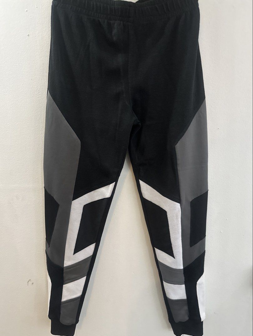 Black Joggers with Geometric Colorblock Design (Category: Joggers) located in Manila. Submitted by rone_cris (Listing ID 1463823303, Image 1). Description: - Stylish black joggers - Features cool geometric panels in grey and white - Comfortable elastic waistband and cuffs - Versatile: great for casual outings or workouts - Offers a comfortable fit - Unique and eye-catching design.