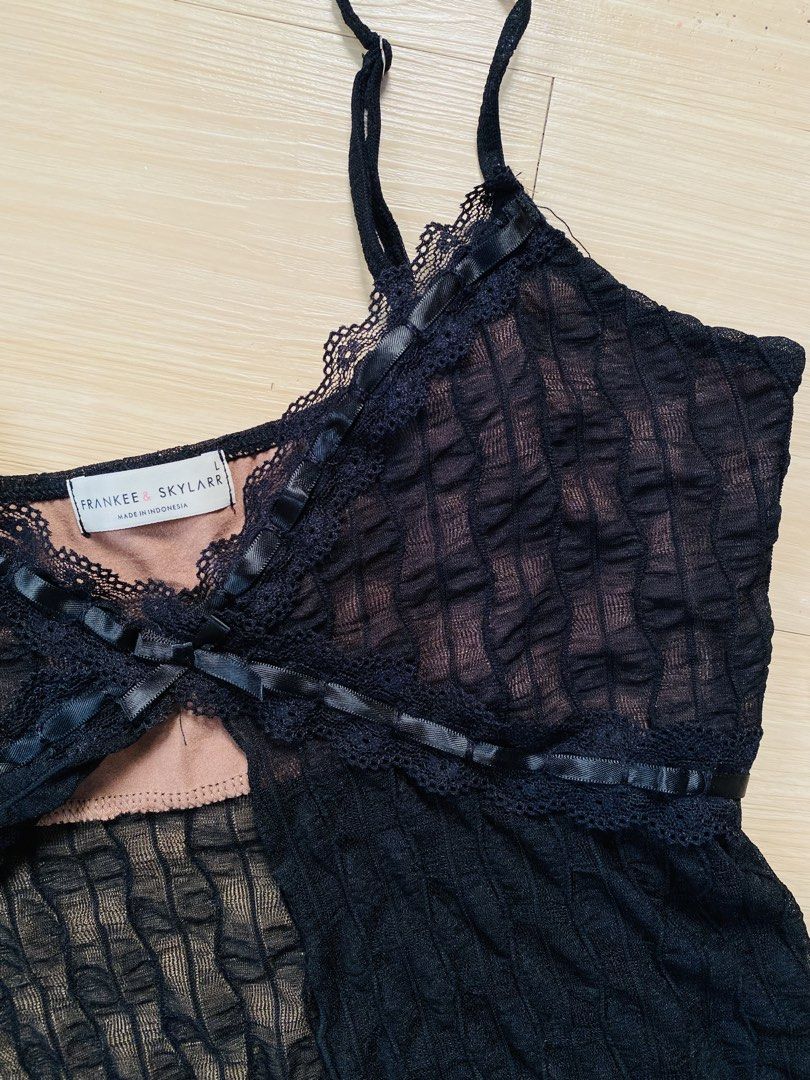 Black Lace Trim Camisole Top (Category: Sleeveless) located in Vigan. Submitted by yourcloset1001 (Listing ID 1463902350, Image 3). Description: - Brand: Frankee + Skylark - Color: Black - Style: Camisole top - Fabric: Textured with sheer overlay - Details: Lace trim on neckline and hem, ribbon details, tie at bust - Straps: Adjustable - Size: L.