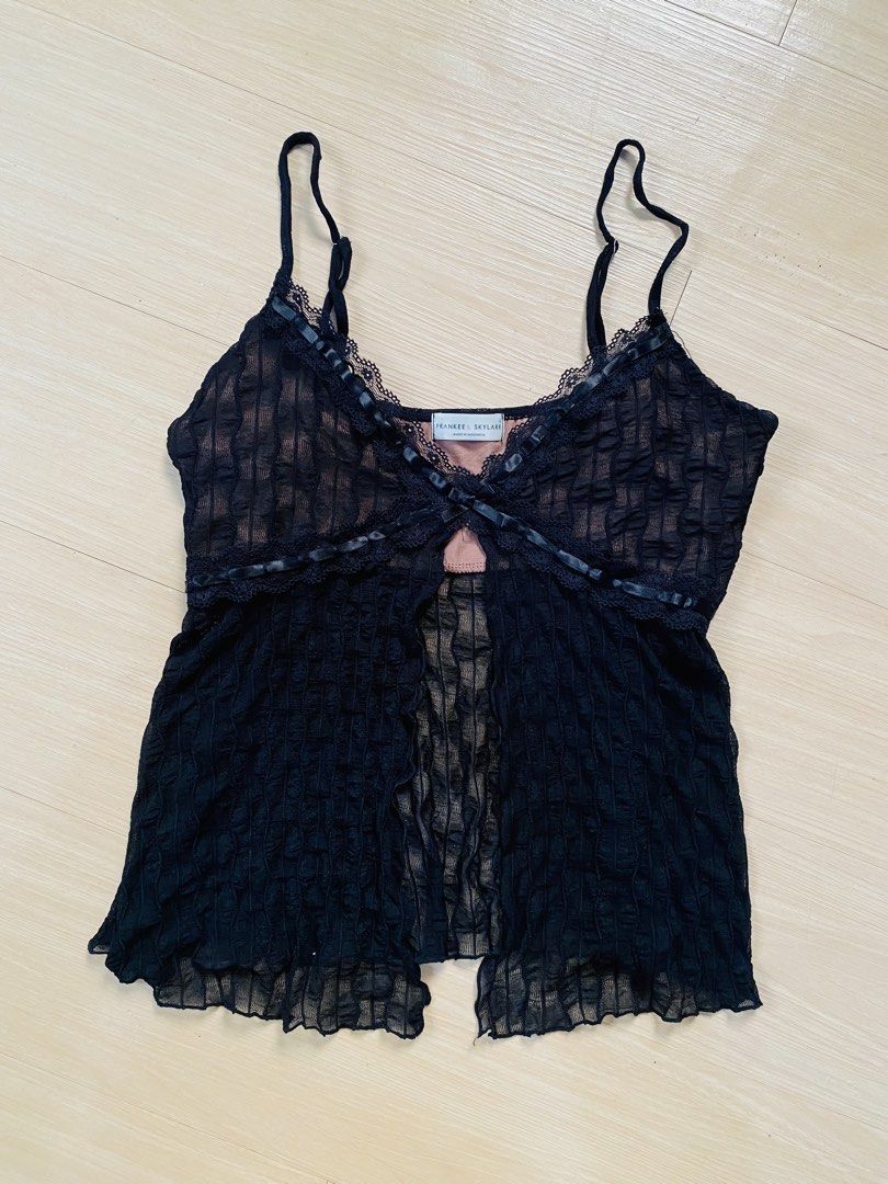 Black Lace Trim Camisole Top (Category: Sleeveless) located in Vigan. Submitted by yourcloset1001 (Listing ID 1463902350, Image 1). Description: - Brand: Frankee + Skylark - Color: Black - Style: Camisole top - Fabric: Textured with sheer overlay - Details: Lace trim on neckline and hem, ribbon details, tie at bust - Straps: Adjustable - Size: L.