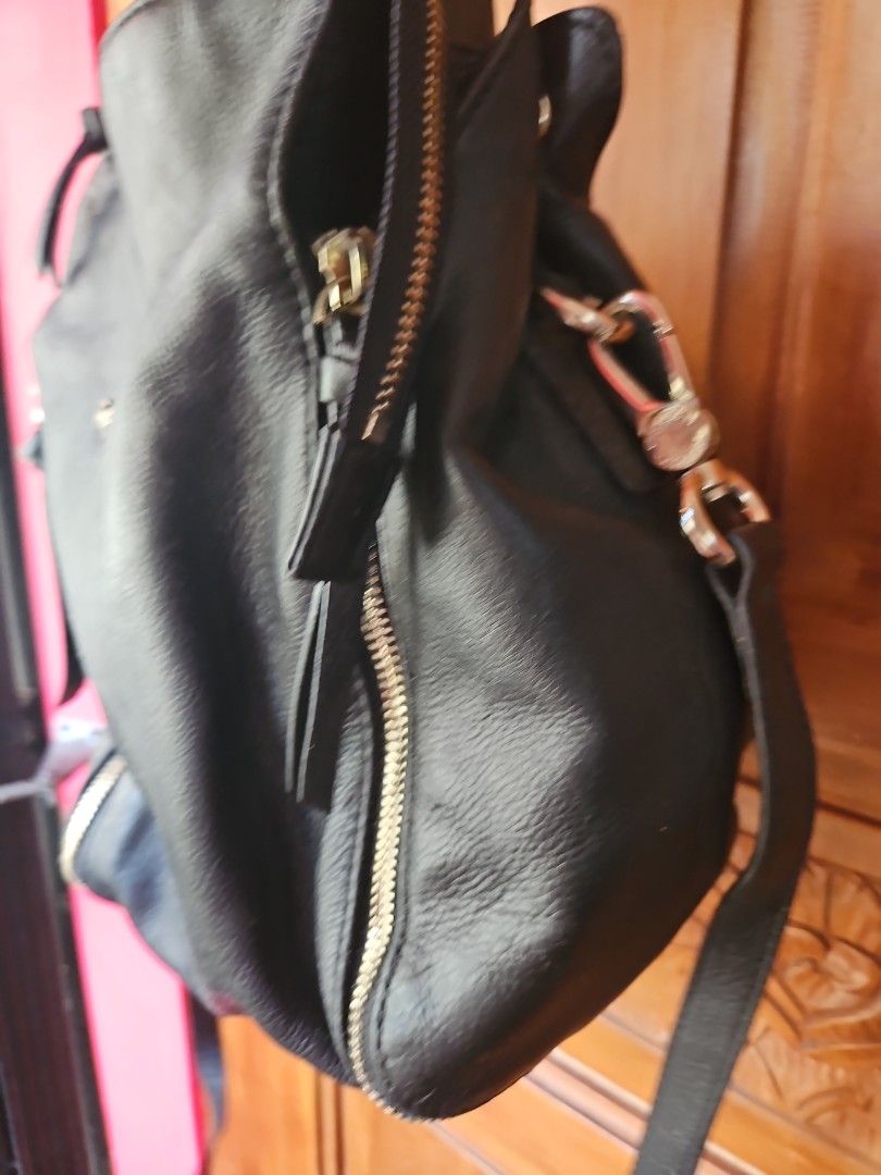 Black Leather Backpack with Silver Hardware (Category: Backpacks) located in Tarlac. Submitted by twop.twob (Listing ID 1463935253, Image 2). Description: - Genuine black leather backpack - Sleek silver zippers and hardware - Adjustable straps for a comfortable fit - Ample interior space for all your essentials - Ideal for everyday use.