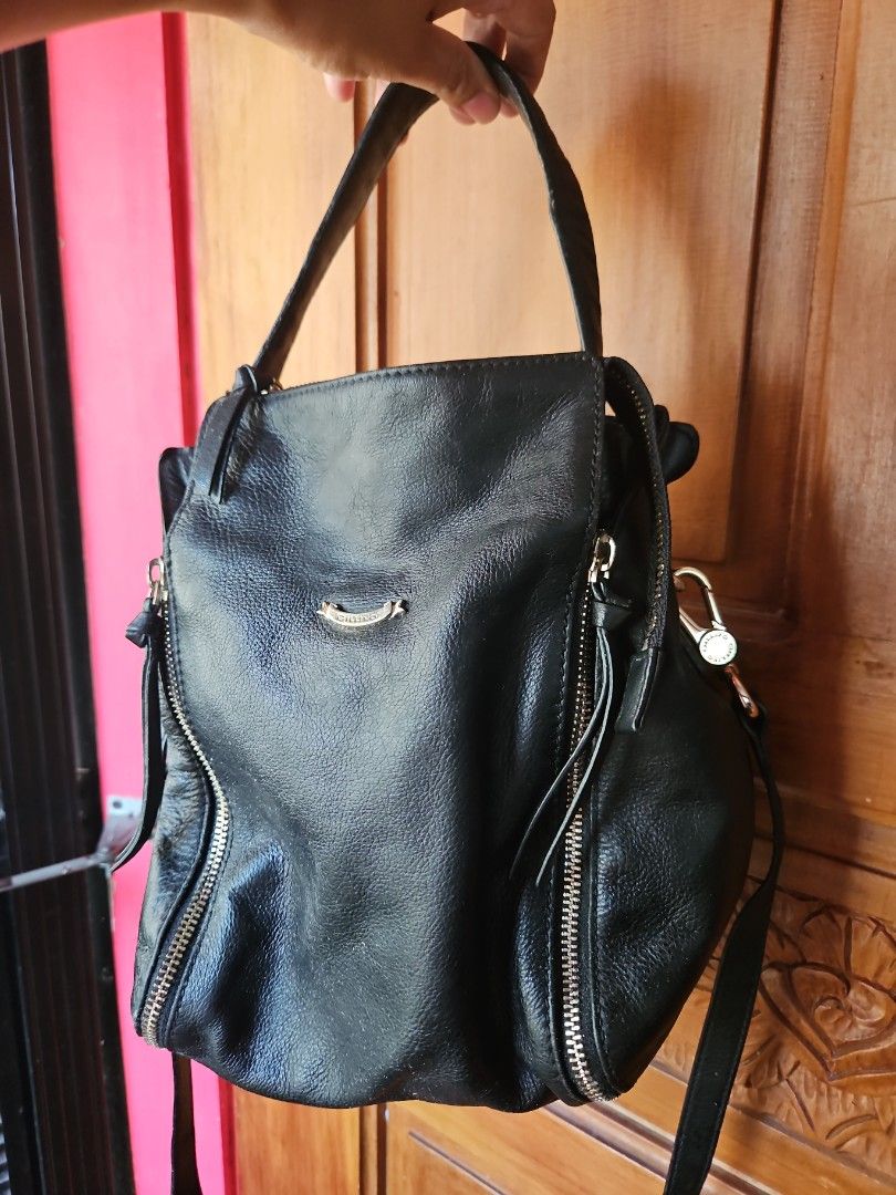 Black Leather Backpack with Silver Hardware (Category: Backpacks) located in Tarlac. Submitted by twop.twob (Listing ID 1463935253, Image 1). Description: - Genuine black leather backpack - Sleek silver zippers and hardware - Adjustable straps for a comfortable fit - Ample interior space for all your essentials - Ideal for everyday use.