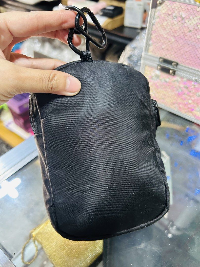 Black Nylon Pouch with Carabiner Clip (Category: Purses & Pouches) located in Manila. Submitted by starbalesukandjapansurplus (Listing ID 1463765873, Image 3). Description: - Small black pouch made of durable nylon - Secure zippered closure with a stylish knotted pull tab - Comes with 2 carabiner clips and a hook for versatile hanging options - Ideal for organizing small essentials like keys, coins, or earbuds - Compact and portable design for ea