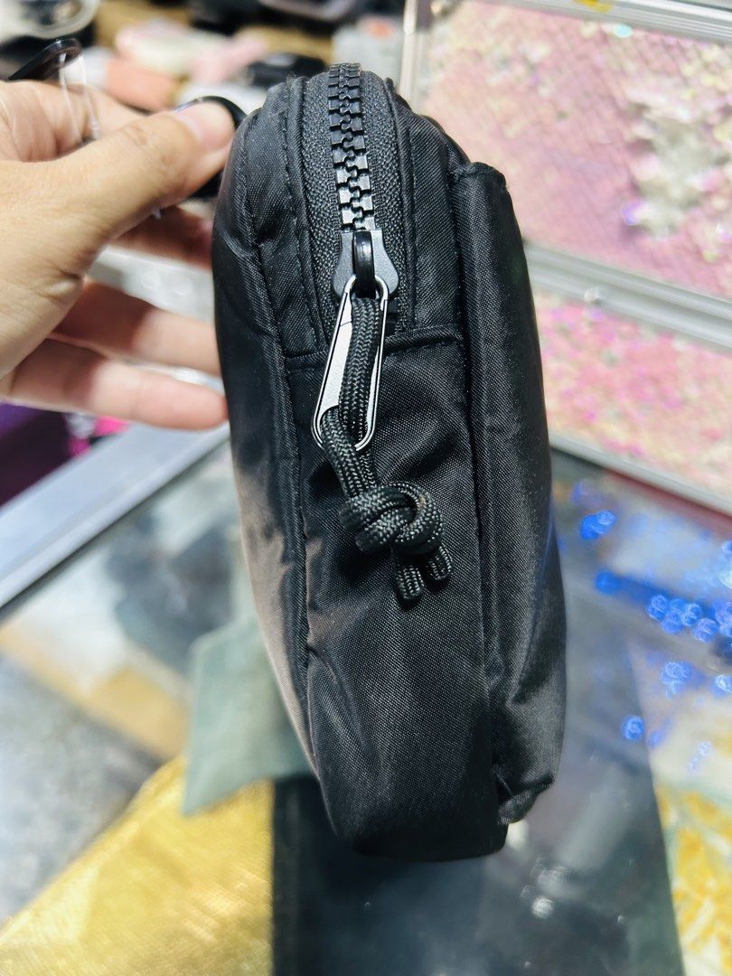 Black Nylon Pouch with Carabiner Clip (Category: Purses & Pouches) located in Manila. Submitted by starbalesukandjapansurplus (Listing ID 1463765873, Image 2). Description: - Small black pouch made of durable nylon - Secure zippered closure with a stylish knotted pull tab - Comes with 2 carabiner clips and a hook for versatile hanging options - Ideal for organizing small essentials like keys, coins, or earbuds - Compact and portable design for ea