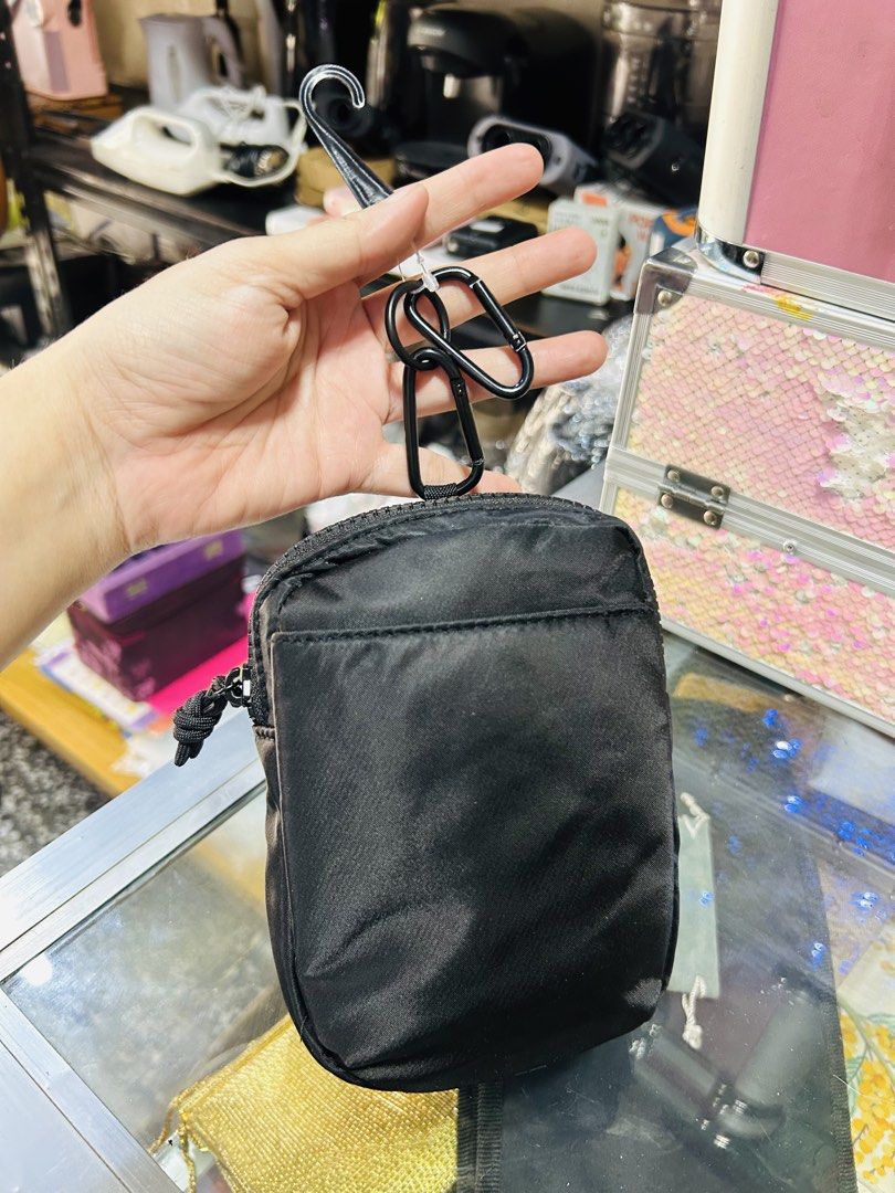 Black Nylon Pouch with Carabiner Clip (Category: Purses & Pouches) located in Manila. Submitted by starbalesukandjapansurplus (Listing ID 1463765873, Image 1). Description: - Small black pouch made of durable nylon - Secure zippered closure with a stylish knotted pull tab - Comes with 2 carabiner clips and a hook for versatile hanging options - Ideal for organizing small essentials like keys, coins, or earbuds - Compact and portable design for ea