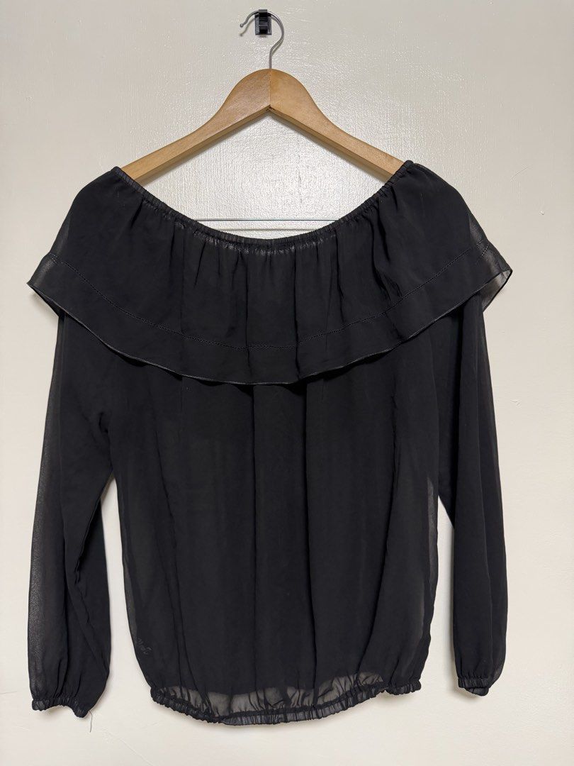 Black Off-Shoulder Ruffle Chiffon Blouse (Category: Blouses) located in Manila. Submitted by don_p (Listing ID 1463869031, Image 1). Description: M to XL - Cute black chiffon blouse - Off-shoulder design with ruffled neckline - Long sleeves with elastic cuffs - Elastic hemline - Button-up front with tie detail at collar - Lightweight and flowy material - Versatile for dressing up or down.