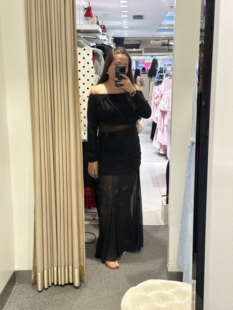 Black Off-Shoulder Sheer Maxi Dress (Category: Dresses) located in Quezon City. Submitted by marie_marie_marie (Listing ID 1463764005, Image 1). Description: - Black off-shoulder maxi dress - Features sheer paneling - Ruched detailing for a flattering silhouette - Long sleeves - Ideal for evening events, parties, or special occasions - Comfortable and stylish fit.