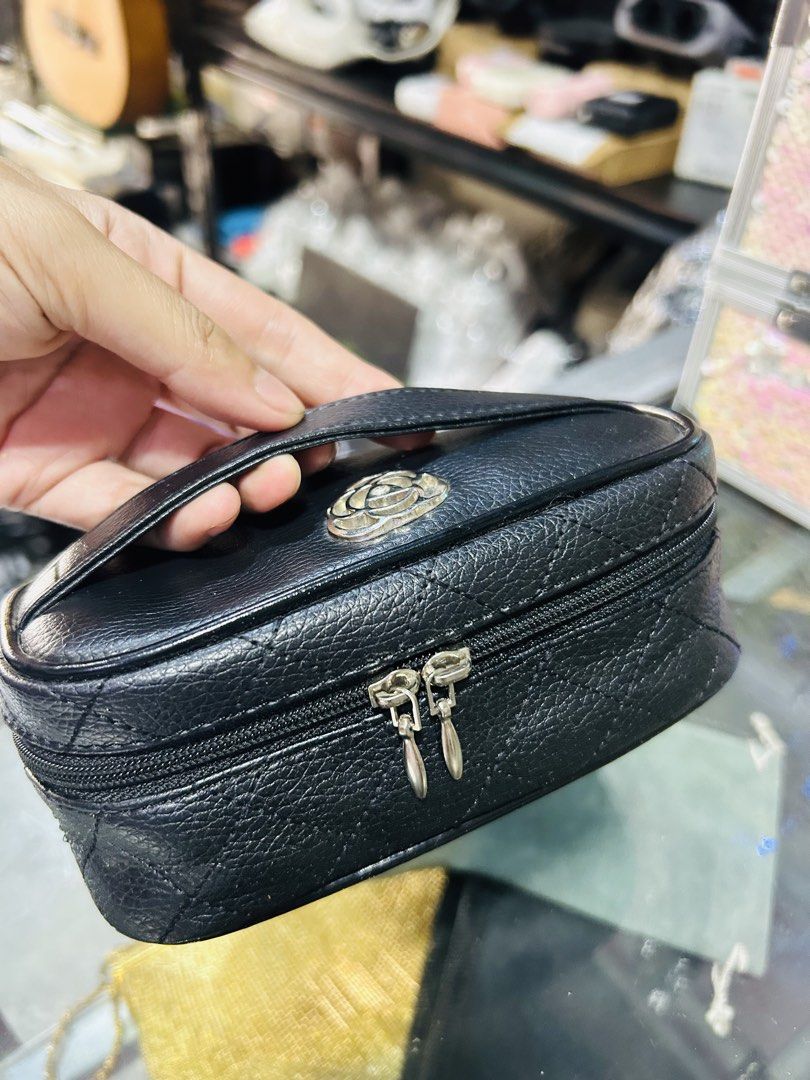 Black Quilted Cosmetic Bag with Handle (Category: Purses & Pouches) located in Manila. Submitted by starbalesukandjapansurplus (Listing ID 1463765801, Image 1). Description: - Stylish black quilted cosmetic bag - Features a convenient top handle - Smooth and reliable zipper closure - Compact and ideal for travel - Durable material with a nice texture - Easily fits into your larger handbag or luggage.