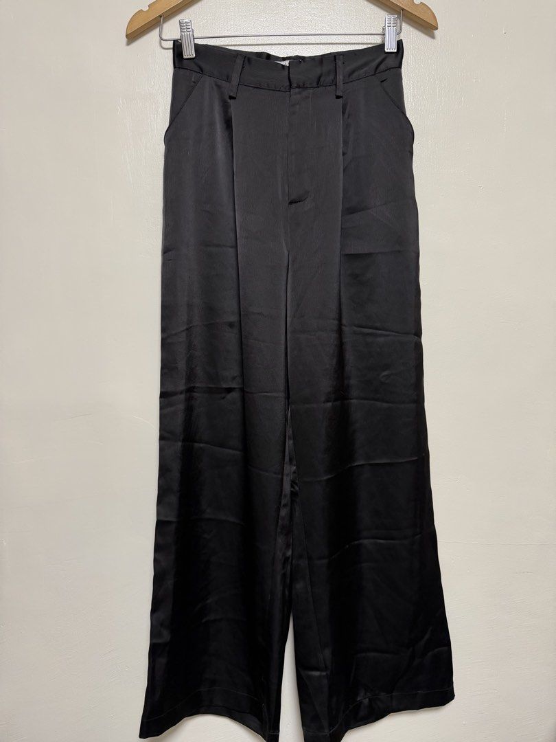 Black Satin Wide Leg Pants (Category: Jeans) located in Manila. Submitted by don_p (Listing ID 1463867320, Image 2). Description: XS to S - Elegant black satin fabric - Flattering wide-leg cut - Comfortable high-waisted design - Functional belt loops - Convenient side pockets - Relaxed fit for all-day comfort - Versatile for dressing up or down.