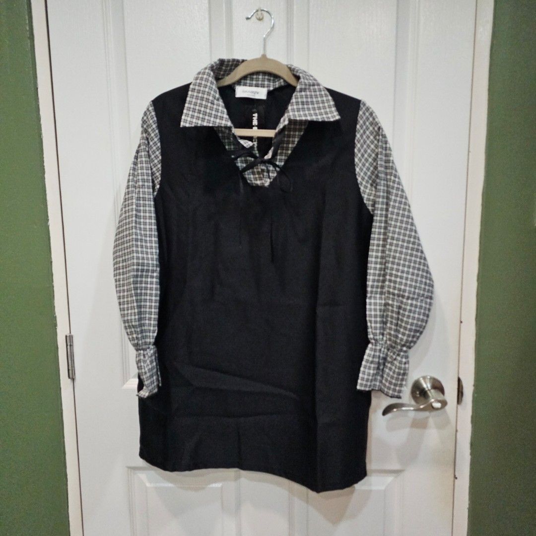Black Shirt with Checkered Sleeves (Category: Tshirts & Polo Shirts ) located in Makati City. Submitted by goldenbird.001 (Listing ID 1463890178, Image 1). Description: - Black shirt - Checkered sleeves and collar - Button-up front - Perfect for a smart casual outfit.