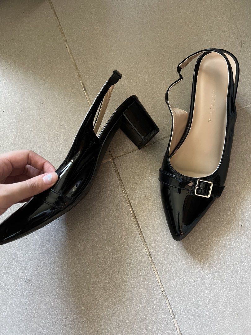 Black Slingback Heels with Buckle Detail (Category: Heels) located in Imus. Submitted by hphzrd333 (Listing ID 1463869276, Image 2). Description: - black patent leather slingback heels - in good condition, worn only once indoors - the strap is a little loose but not an issue.