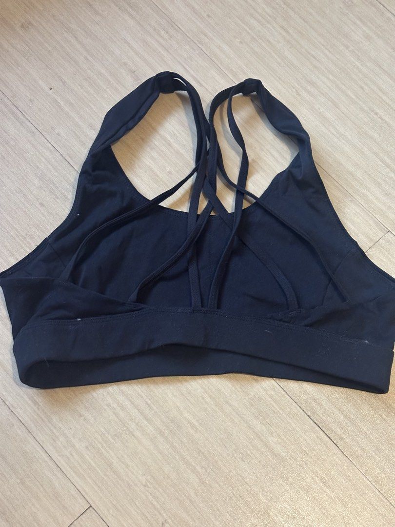 Black Strappy Sports Bra (Category: Activewear) located in Mandaluyong City. Submitted by youarecutejeans (Listing ID 1463818265, Image 1). Description: - Sleek black sports bra - Unique strappy back design - Comfortable and supportive for workouts - Elastic band for a secure, snug fit - Ideal for yoga, gym, and running - Effortlessly pairs with any leggings.