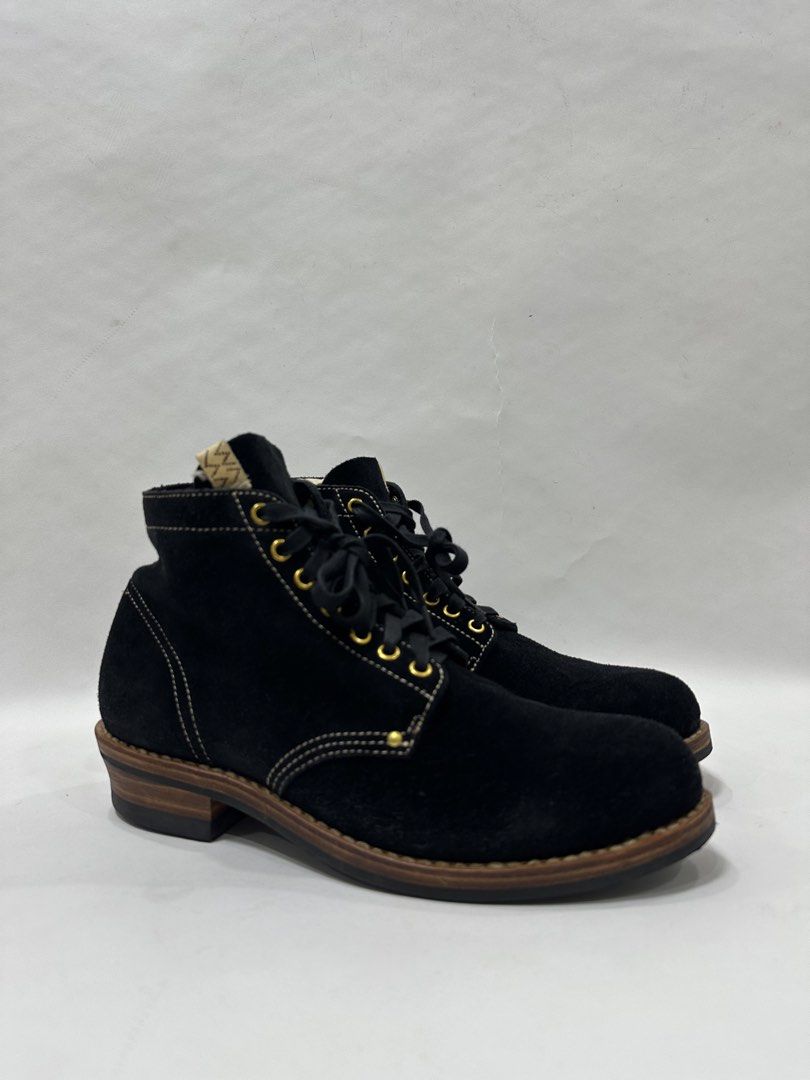 VISVIM Black Suede Lace-Up Boots (Category: Boots) located in Makati City. Submitted by 9thcolt (Listing ID 1463790966, Image 2). Description: - Black suede boots - White stitching detail - Lace-up front with gold eyelets - Wooden heel - Includes original box and tissue paper - Ideal for casual wear.