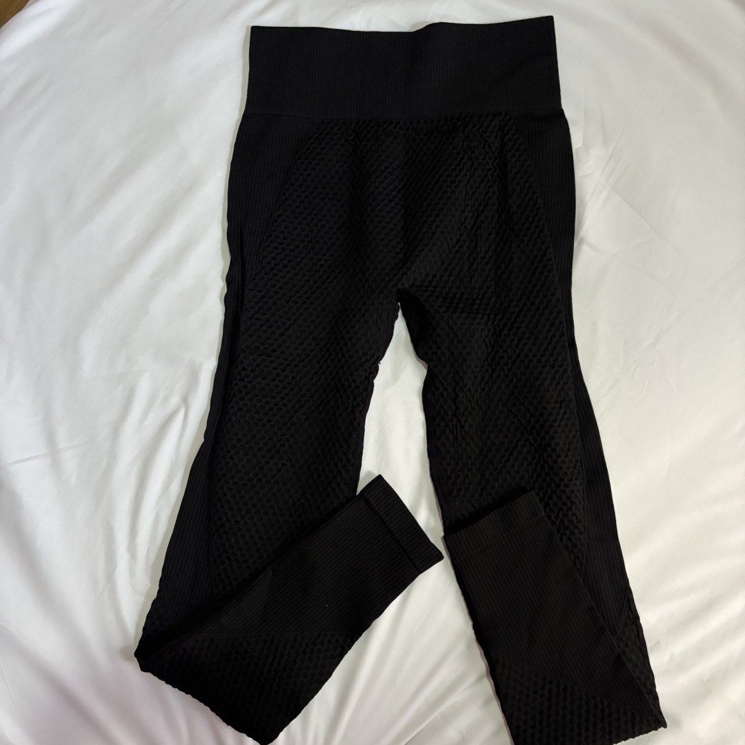 Black Textured High Waisted Seamless Leggings (Category: Activewear) located in Bacoor. Submitted by jlistsshop2020 (Listing ID 1463922347, Image 2). Description: - Black seamless leggings - Textured honeycomb pattern - High-waisted fit with ribbed waistband - Stretchy and comfortable - Full length - Ideal for workouts and everyday wear.
