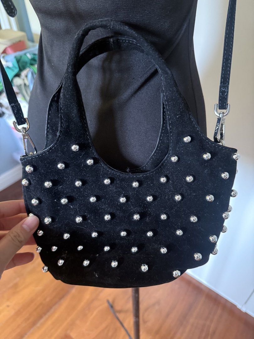 Black Velvet Studded Mini Handbag with Shoulder Strap (Category: Purses & Pouches) located in Manila. Submitted by cristycrab247 (Listing ID 1463823271, Image 2). Description: - Cute black velvet mini bag - All-over silver stud embellishments - Includes a top handle - Detachable shoulder strap for versatility - Compact size, ideal for carrying essentials - Stylish for both night outs and casual wear.
