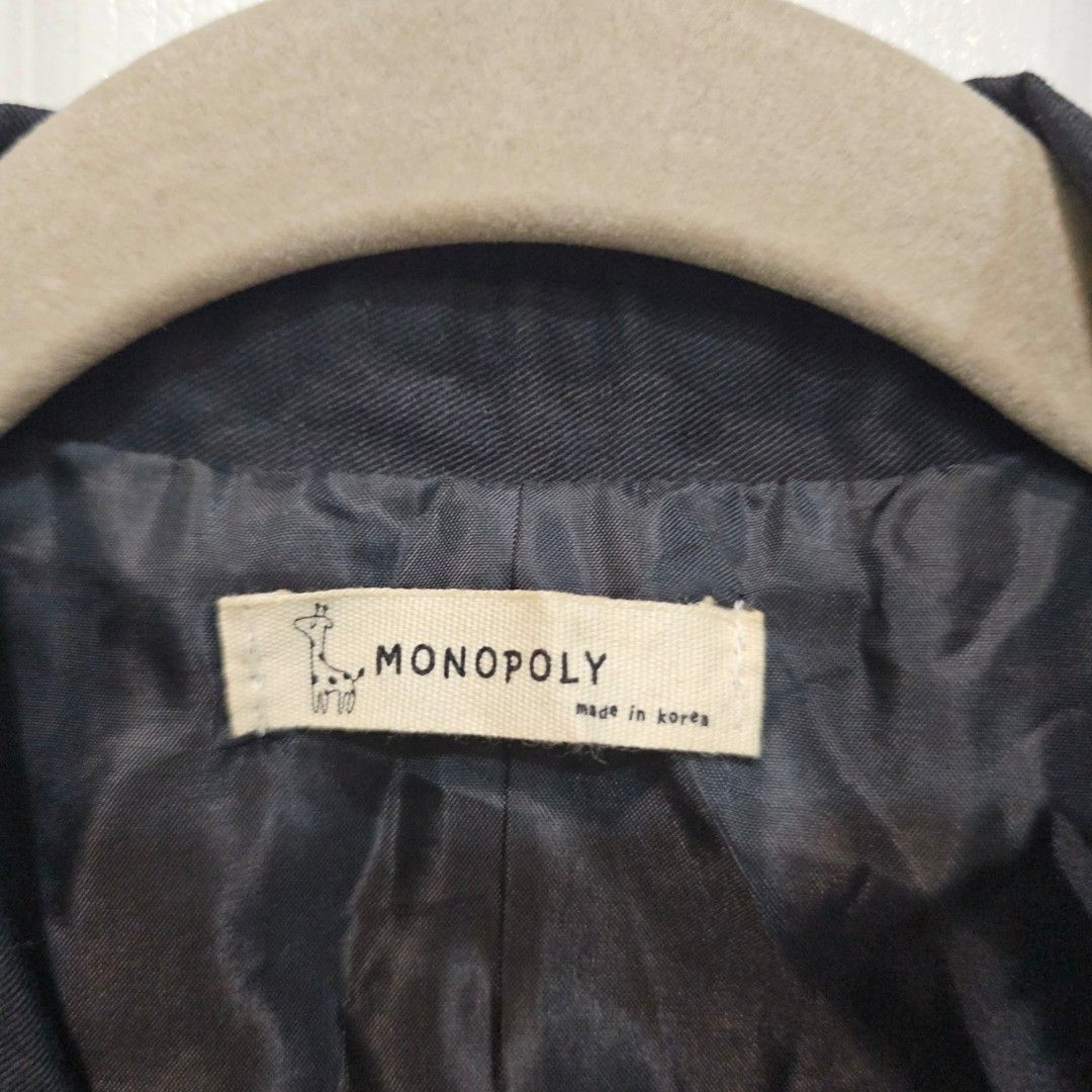 Black Vest (Category: Sleeveless) located in Makati City. Submitted by goldenbird.001 (Listing ID 1463842207, Image 3). Description: - Brand: MONOPOLY - Color: Black - Style: Sleeveless vest - Closure: Single button - Cut: Classic - Origin: Made in Korea - Versatile: Great for layering over shirts or dresses.