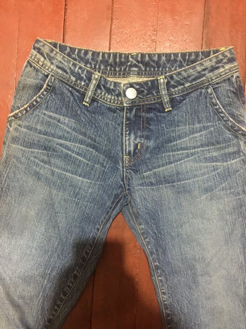 Blue Denim flared/Bootcut Jeans (Category: Jeans) located in Manila. Submitted by carlosrexc26753 (Listing ID 1463919109, Image 3). Description: WAISTLINE:28 LENGTH:41 - Classic blue denim jeans - Bootcut style (slight flare at the bottom) - Button and zip fly closure - Two back pockets with button details - Shows natural fading and creasing from wear - Ideal for casual outfits.