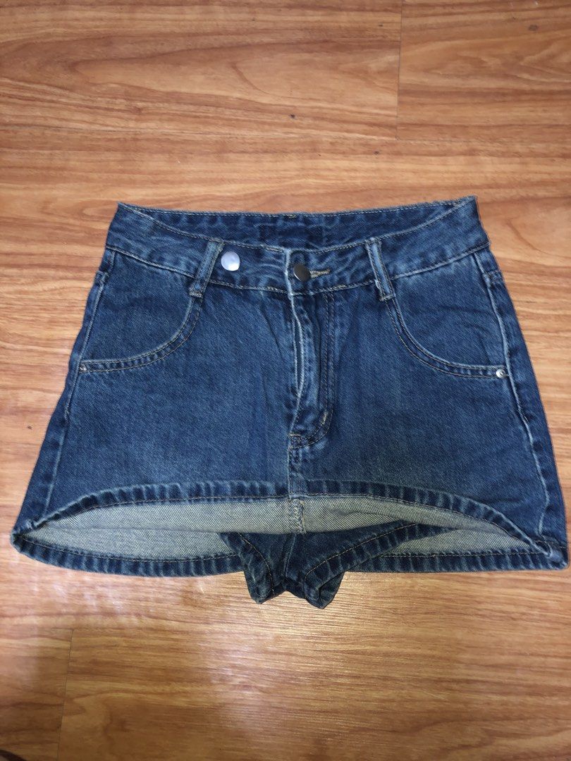 Blue Denim Mini Skirt with Shorts Underlay (Category: Skirts) located in Manila. Submitted by zhala_dawn3 (Listing ID 1463746237, Image 2). Description: Cute blue denim mini skirt with built-in shorts. Features classic five-pocket styling, button/zip closure. Perfect for casual outfits..