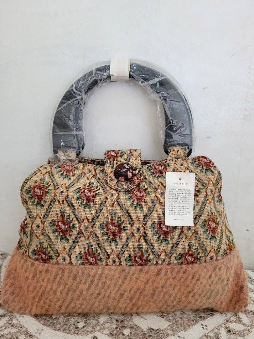 Bnew Tapestry Handbag (Category: Purses & Pouches) located in Balanga. Submitted by marae_c (Listing ID 1463754784, Image 1). Description: In very good condition. New, unused. Very pretty in actual. Wooden hard handles with inner lining. Snap button closure. Fits your essentials. Kasya mini payong. Gandaa 💗 small to semi med size bag pero spacious enough naman for daily..