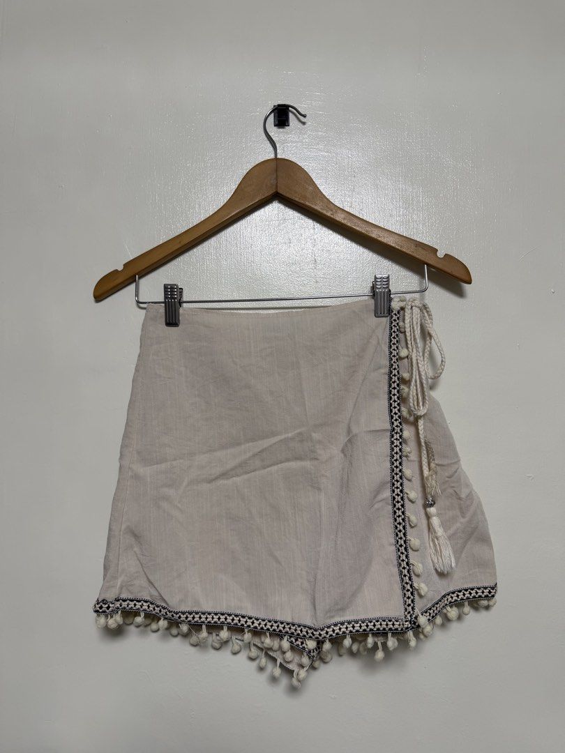 SHEIN - Boho Pom Pom Trim Wrap Shorts (Category: Shorts) located in Manila. Submitted by don_p (Listing ID 1463866029, Image 1). Description: S to M - Lightweight wrap shorts - Adorable pom pom trim - Convenient side tie detail - Natural, textured fabric - Ideal for casual outings or beach days - Effortless to style.