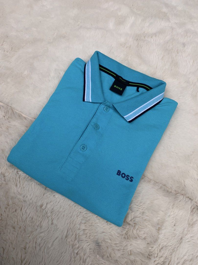 BOSS Regular Fit Polo Shirt - Turquoise (Category: Tshirts & Polo Shirts ) located in Cateel. Submitted by janicegpad45049 (Listing ID 1463880895, Image 1). Description: - Brand: BOSS - Color: Turquoise - Size: L - Fit: Regular - Features: Embroidered BOSS logo on chest, contrasting stripe detail on collar and sleeve cuffs - Style: Casual wear.