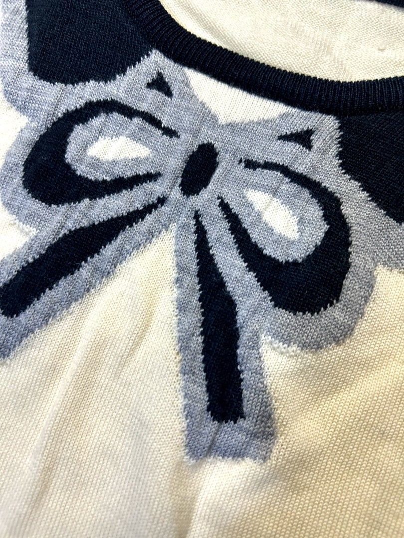 Bow Cream Knitted Sweater (Category: Longsleeves) located in Marikina City. Submitted by wearablearttt (Listing ID 1463932155, Image 3). Description: Bow Cream Knitted Sweater 𖨆 LAID FLAT MEASUREMENTS ‎L 22" ‎W 14-17.5".