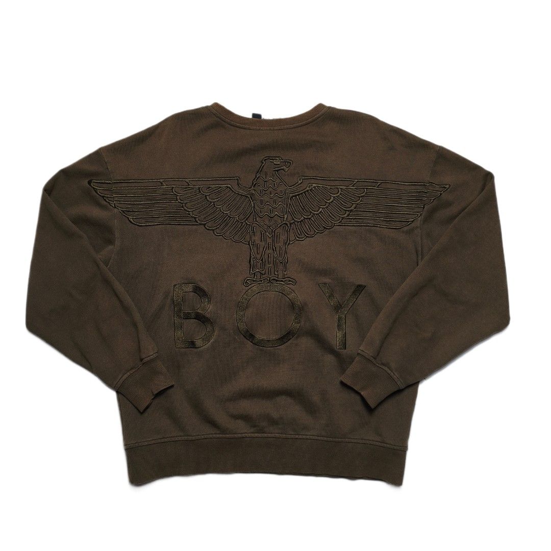 BOY London Eagle Logo Zip Pocket Sweatshirt (Category: Coats, Jackets and Outerwear) located in Meycauayan. Submitted by thrifting_gorilla (Listing ID 1463930958, Image 1). Description: - Authentic BOY London sweatshirt - 22 X 25 - Sleeves: 22 - Full embroidered Iconic eagle and 'BOY' logo prominently displayed on the back - Convenient zip pocket detail on the front - 'BOY LONDON' tag intact - Ideal for everyday casual wear.