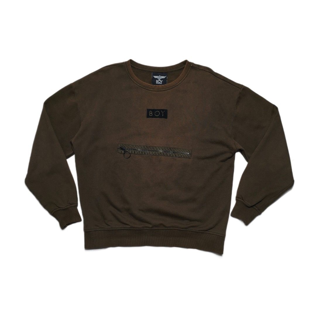 BOY London Eagle Logo Zip Pocket Sweatshirt (Category: Coats, Jackets and Outerwear) located in Meycauayan. Submitted by thrifting_gorilla (Listing ID 1463930958, Image 2). Description: - Authentic BOY London sweatshirt - 22 X 25 - Sleeves: 22 - Full embroidered Iconic eagle and 'BOY' logo prominently displayed on the back - Convenient zip pocket detail on the front - 'BOY LONDON' tag intact - Ideal for everyday casual wear.
