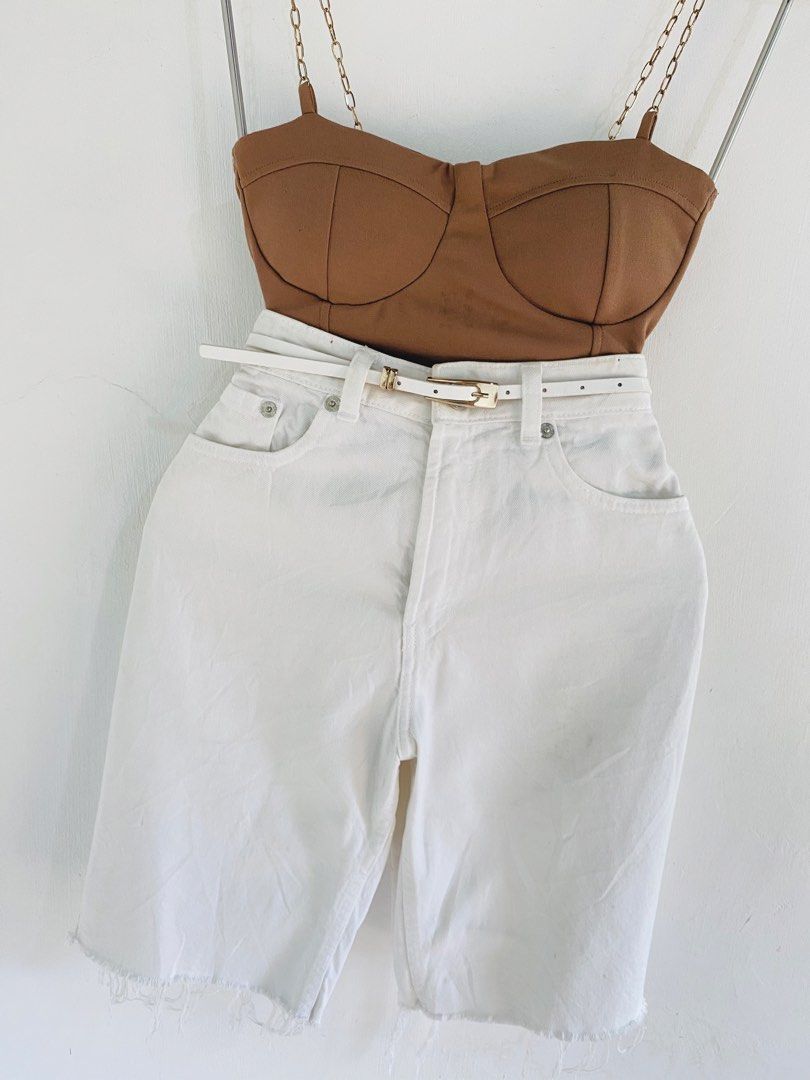 Brown Bustier Top & White Denim Shorts Set (Category: Sets or Coordinates) located in Vigan. Submitted by yourcloset1001 (Listing ID 1463914368, Image 2). Description: - Cute brown bustier top with stylish chain straps. - High-waisted white denim shorts with a trendy frayed hem. - Includes a white belt with a chic gold buckle. - Versatile outfit for casual outings or nights out. - Mix and match pieces with your existing wardrobe..