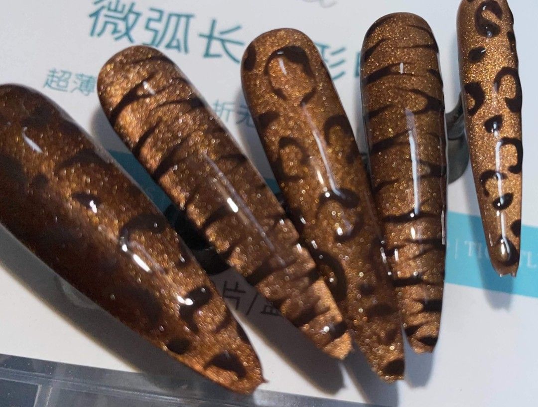 Brown Glitter Leopard Print Press-On Nails (Category: Hands & Nails) located in Manila. Submitted by demodelechic (Listing ID 1463871680, Image 1). Description: - Brown glitter press-on nails - Leopard print design - Coffin shape - Glossy finish - Chic and stylish - Easy to apply - Sold as a set.