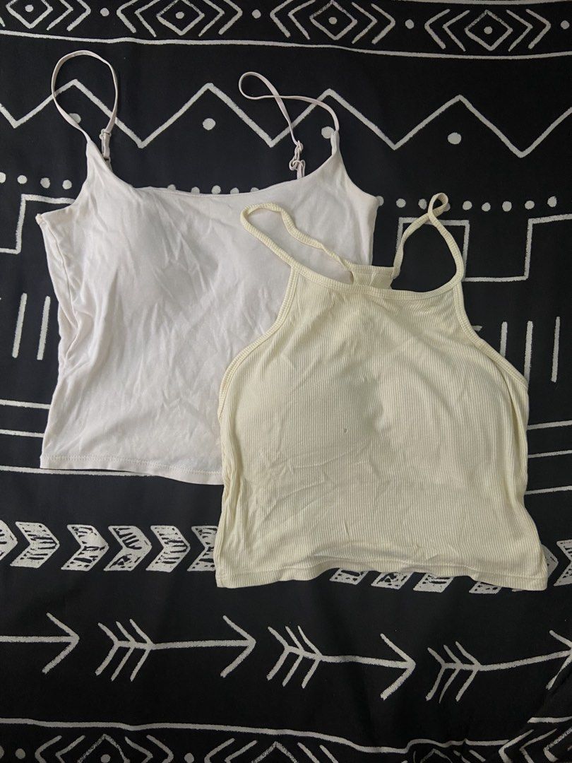 BUNDLE OF 2: Padded Basic Tops (Category: Sleeveless) located in Pasig City. Submitted by ellerarissime (Listing ID 1463798346, Image 1). Description: Item 1: Plain White Cami • Features: Built-in chest padding, adjustable spaghetti straps • Size: Best fits XS to Small • Condition: Good preloved condition, clean, no stains Item 2: Butter Yellow Ribbed Halter Crop Top • Features: Built-in chest padding, halter neck style • Size: Best fits XS to Sm